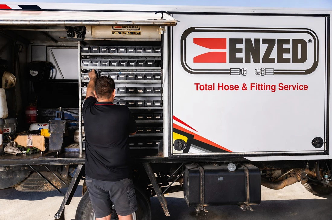 ENZED HOSE DOCTOR working beside a service truck