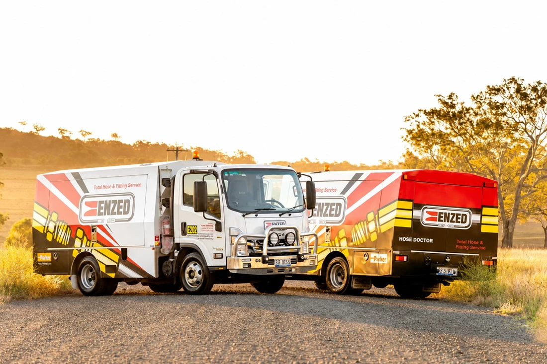 ENZED HOSE DOCTOR beside a service truck